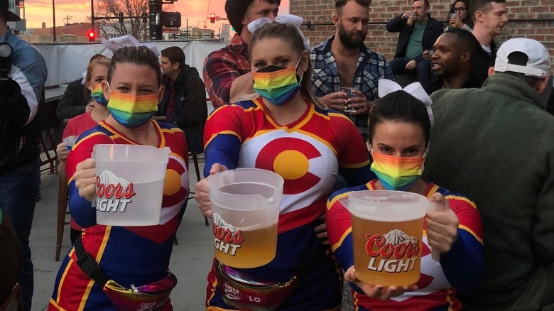 women holding pitchers of beer