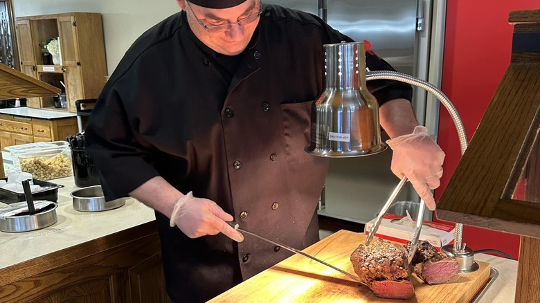 Chef slicing meat