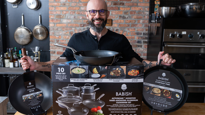 Andrew Rea posing with new cookware line 