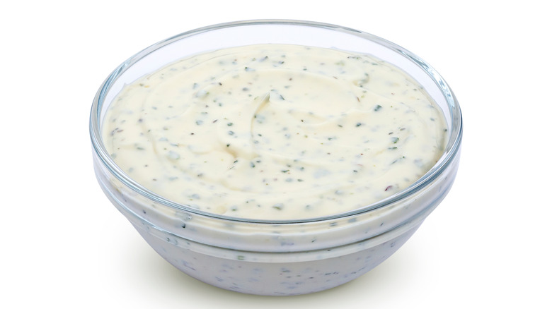 Aioli in a clear bowl on a white background