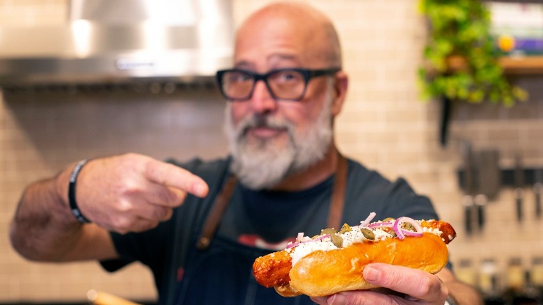 Andrew Zimmern with a hot dog