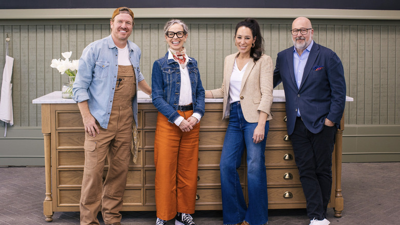 Andrew Zimmern smiling with Silos judges