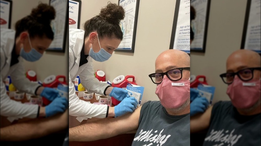 Andrew Zimmern gets vaccine