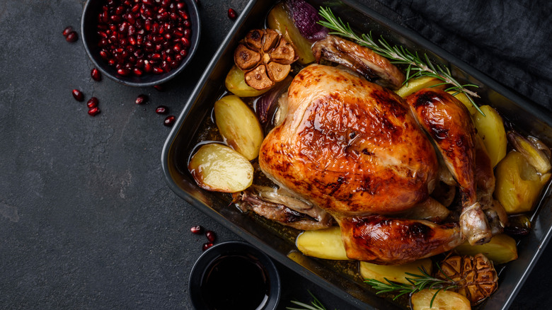 roasted chicken with veggies in a pan