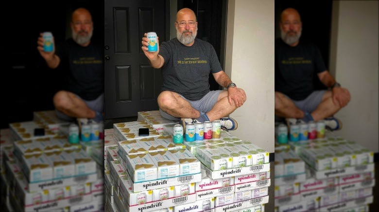 Andrew Zimmern sitting on top of Spindrift cases