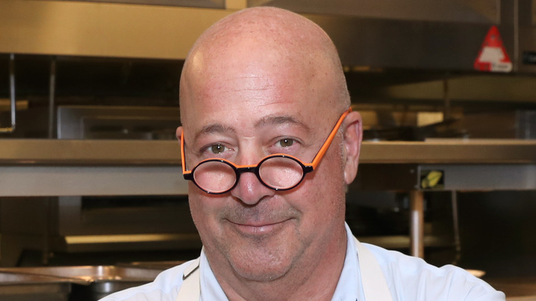 Andrew Zimmern in a kitchen 