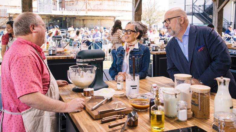 Zoe Francois and Andrew Zimmern talking to contestant Frank