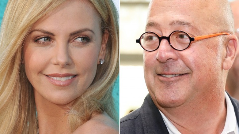 Charlize Theron and Andrew Zimmern smiling 