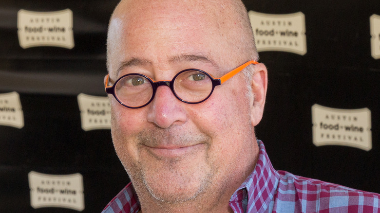 Close up of Andrew Zimmern wearing plaid shirt 