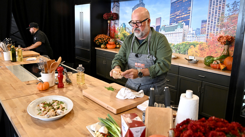 Andrew Zimmern cooking