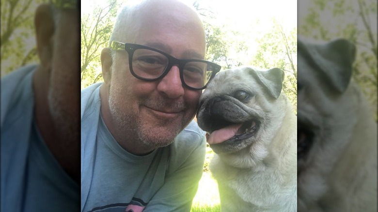 Andrew Zimmern with his pug 