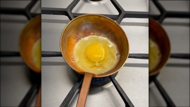 Eggs cooking in a spoon