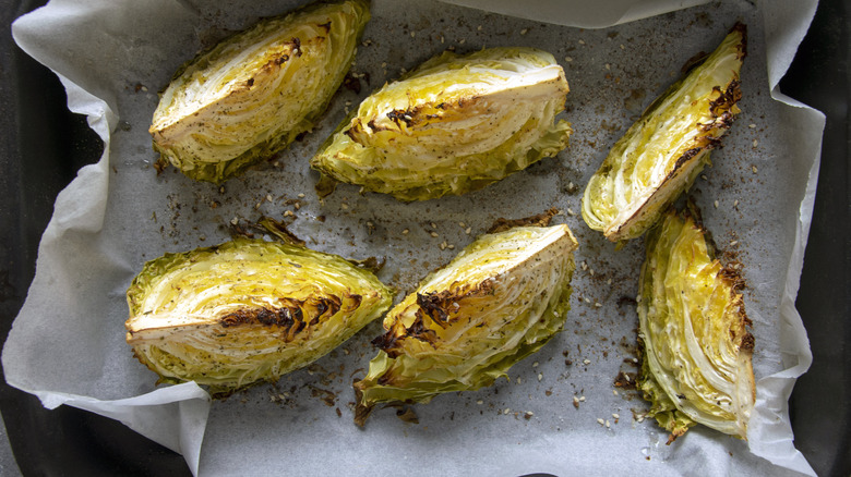 wedges of roasted cabbage on baking sheet