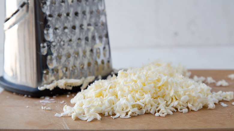 grated butter on cutting board 