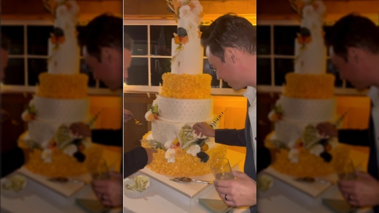 wedding guests dig into cake