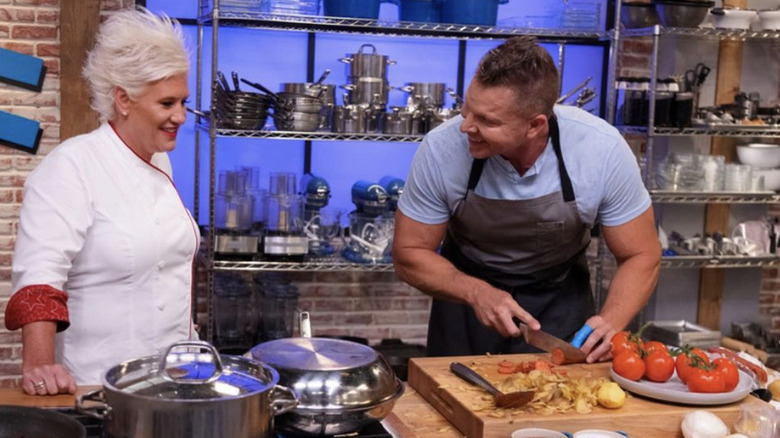 Anne Burrell in the kitchen with contestant