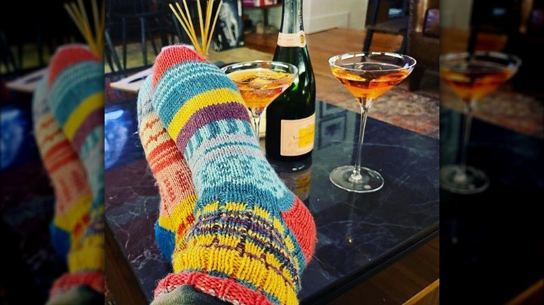 Cozy socks and pink champagne