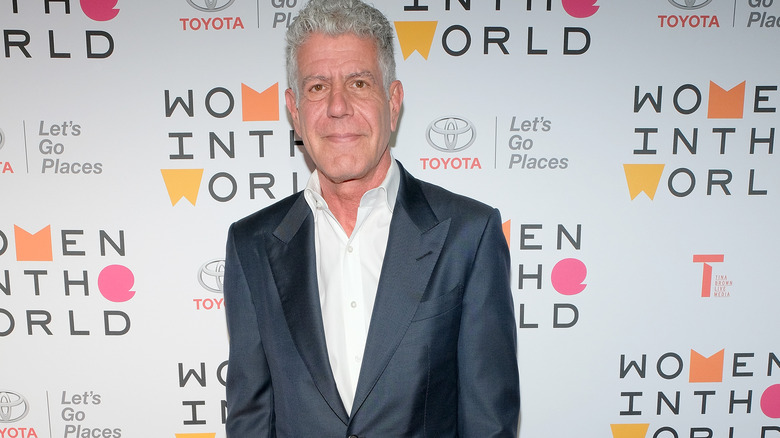 Anthony Bourdain wearing blue suit