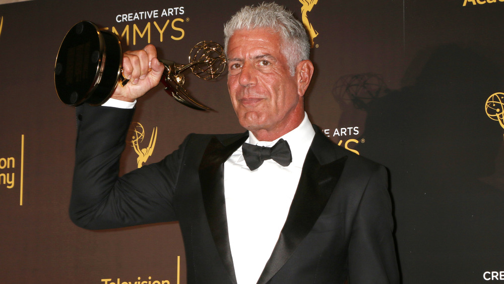 Anthony Bourdain with an Emmy Award