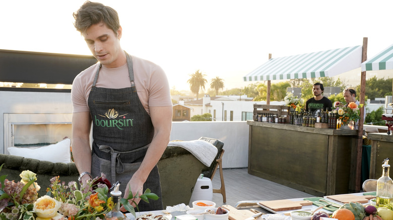 Antoni Porowski cooking outside