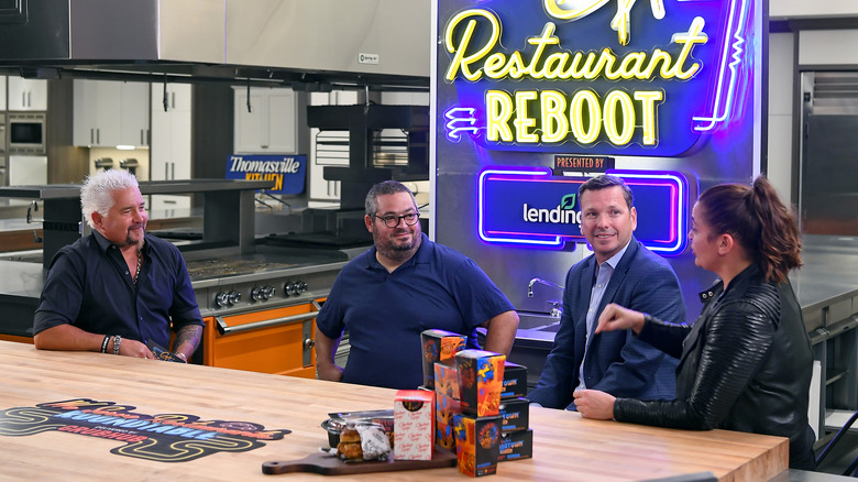 Guy Fieri, Eric Greenspan another chef and Antonia Lofaso chatting a panel during Restaurant Reboot