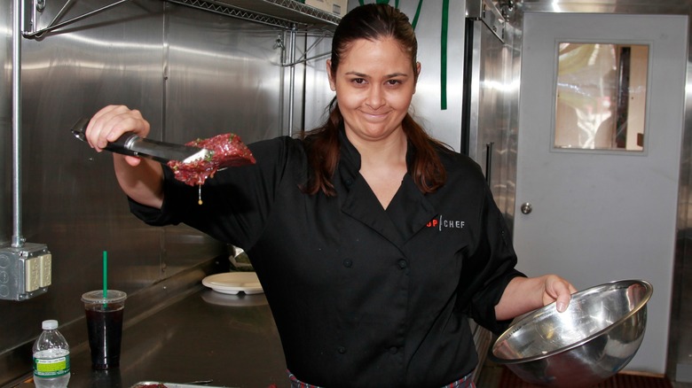 Antonia Lofaso holding up some weird-looking food