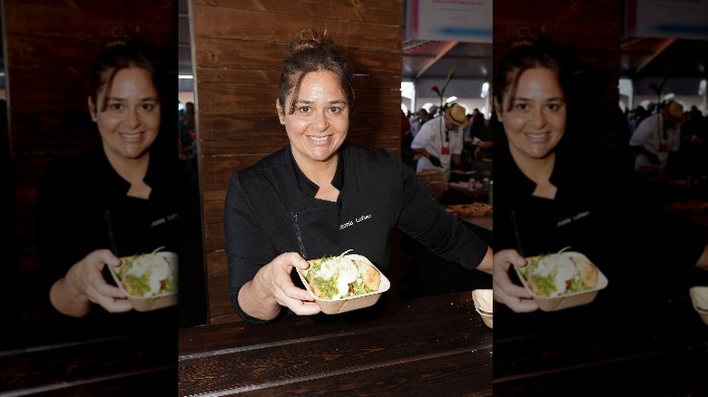 Antonia Lofaso handing out food