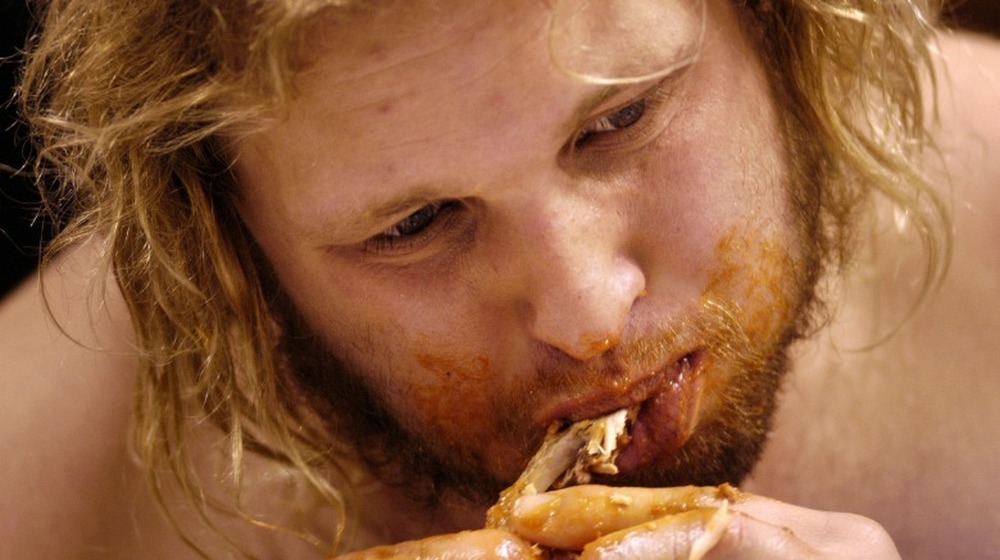 Man eating buffalo wings