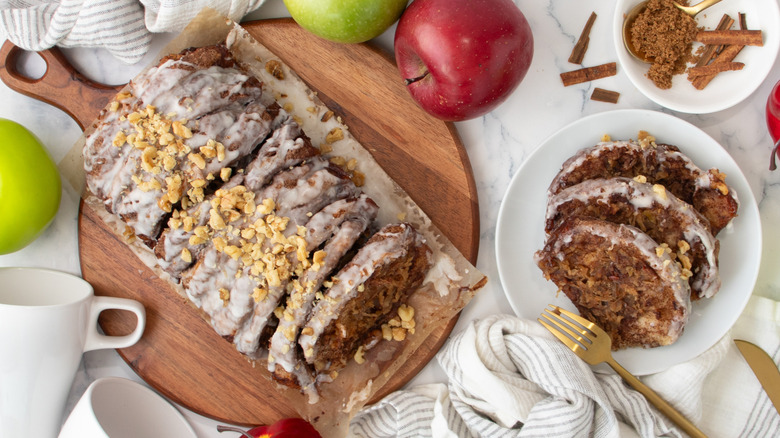 pull-apart apple pie loaf with icing and walnuts