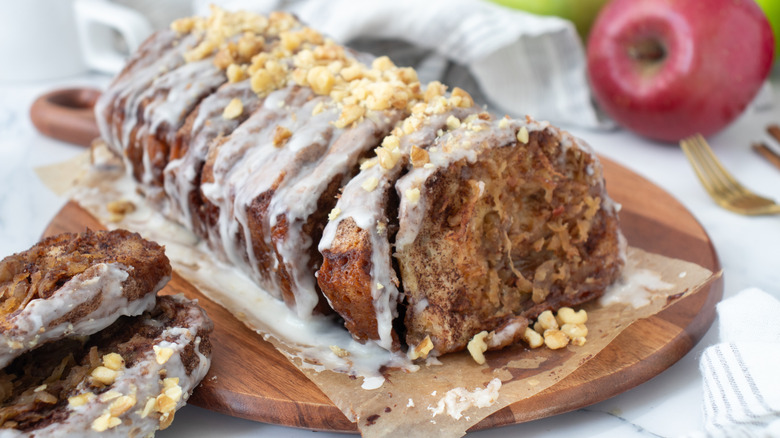 Pull-apart apple pie loaf with icing and walnuts