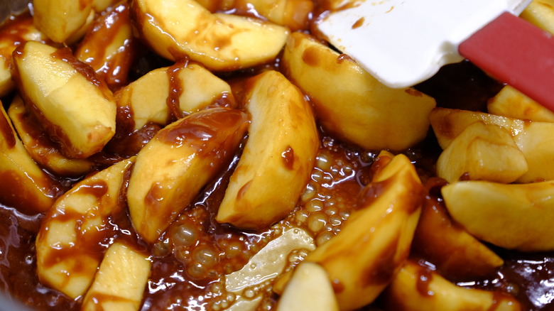 apples cooking in caramel