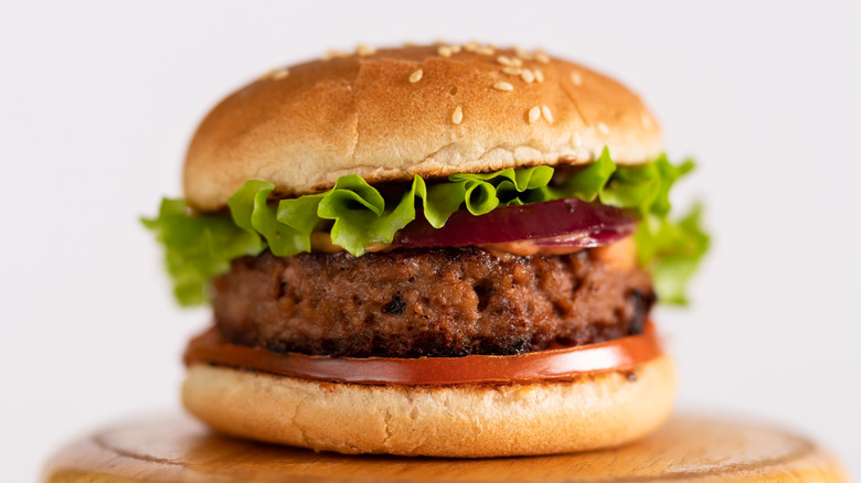 impossible burger on wooden stool