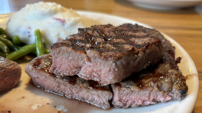 Sliced steaks on plate