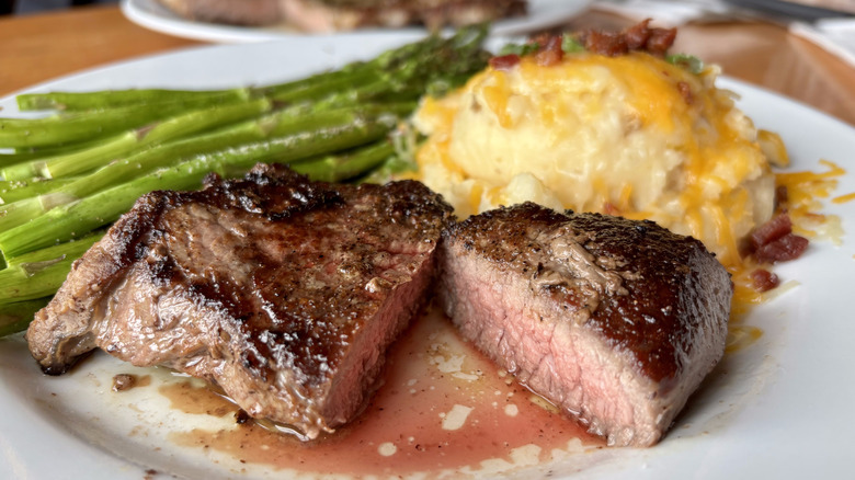 Cross section of steak with asparagus and mashed potatoes