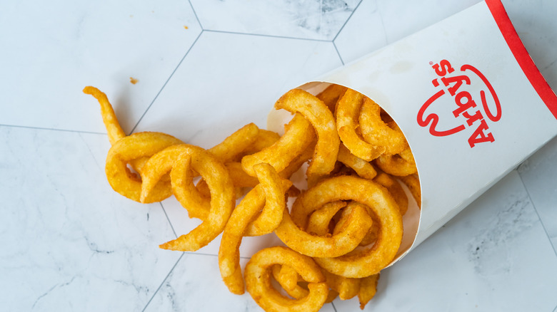 Arby's curly fries on table