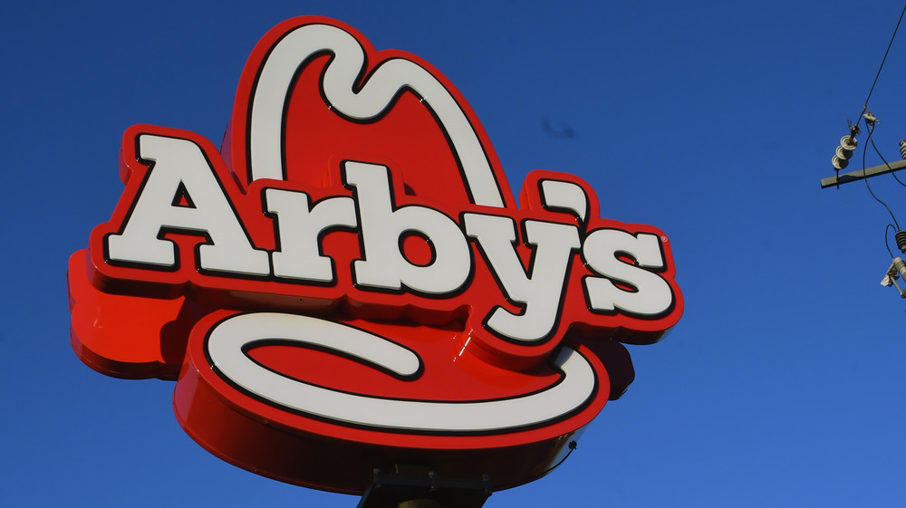 Arby's sign against blue sky