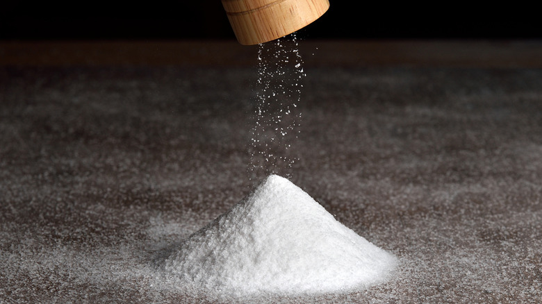 Grinder above pile of salt