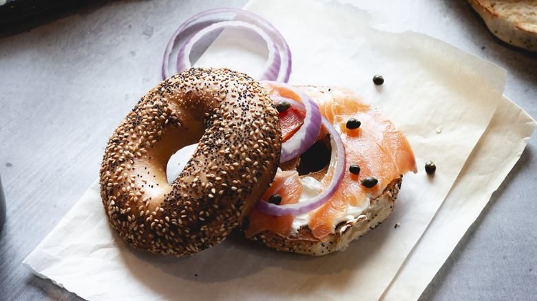 Bagel with lox, onions, and capers