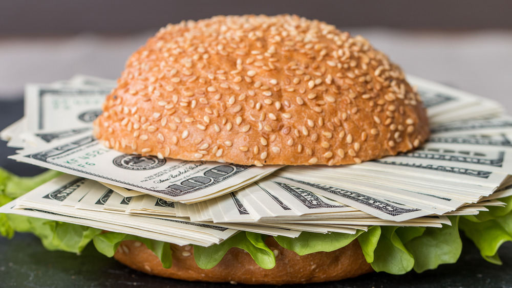 Hamburger bun filled with money