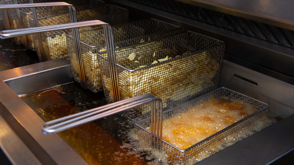 Potatoes being deep fried