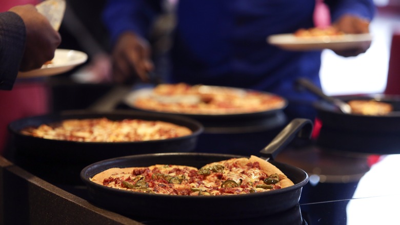 Customers select pizza slices