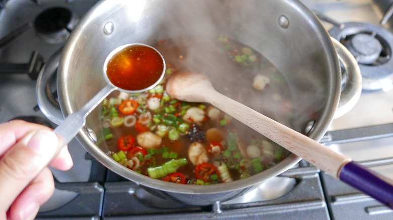 spices and broth in pot 