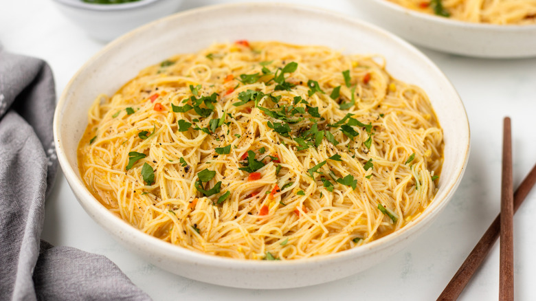 Bowl of coconut curry noodles with cilantro