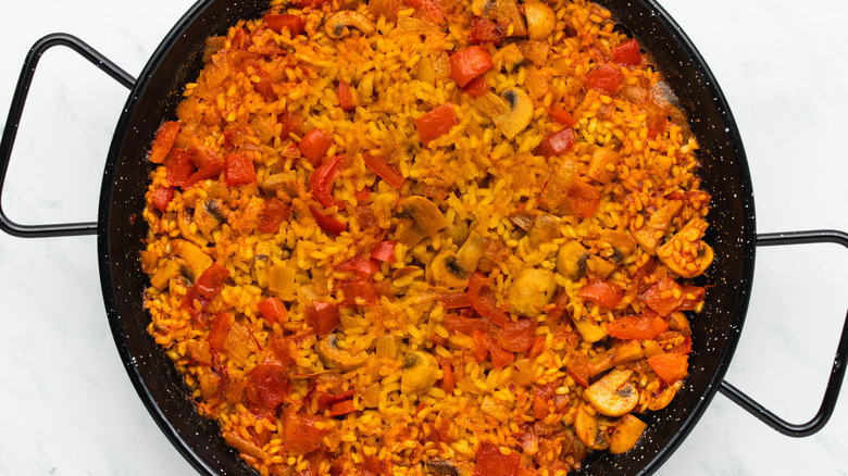 paella rice cooked with veggies