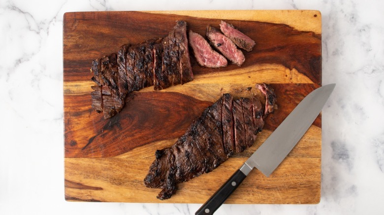 sliced steak on cutting board