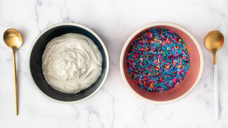 melted white chocolate and sprinkles in bowls