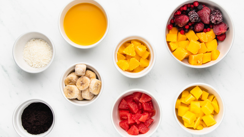 Mango citrus açaí bowl ingredients laid out