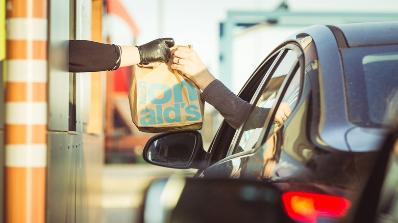 drive-thru customer receiving McDonald's order