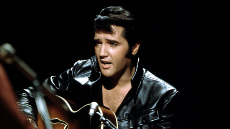 Elvis performing with guitar