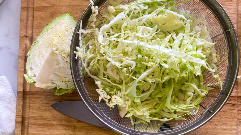 Shredded cabbage in a colander